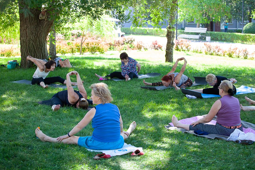 A person in a dynamic but controlled yoga pose, showing fluidity of movement.